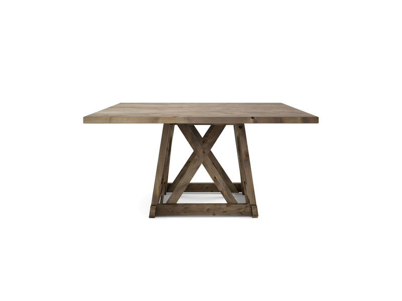 The Julia Square Dining Table - Barn Wood by James+James is a square wooden dining table featuring a thick tabletop and a geometrically designed base. The base includes a central X-shaped support that connects to parallel beams, providing sturdy structure. Its natural finish highlights the wood's grain and texture beautifully.