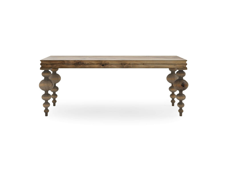 The Olivia Sofa Table - Harvest Wheat by James+James is a wooden table featuring a rectangular top and intricately carved, bulbous legs. The table boasts a rustic finish that highlights the natural wood grain and knots. Its legs are crafted with rounded, stacked shapes, enhancing its elegant and antique charm.