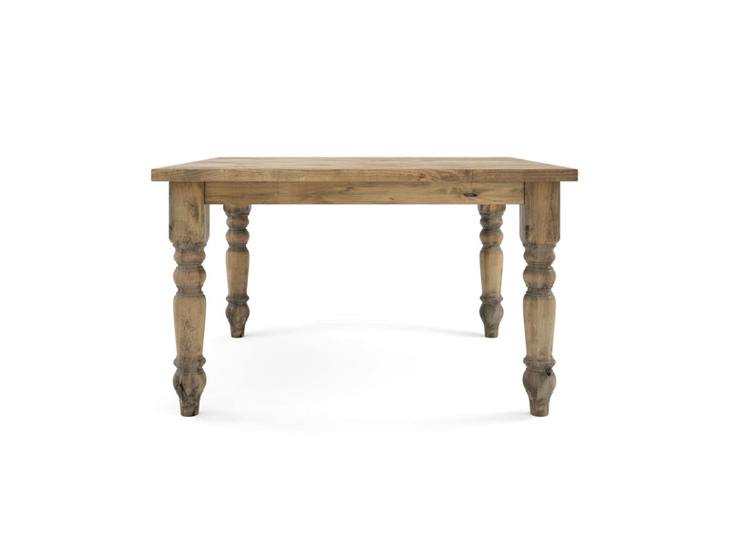 The Baluster Square Dining Table in Harvest Wheat by James+James features a rectangular top and four intricately carved legs. The visible natural wood grain gives the table a vintage and handcrafted appearance, all set against a white background.