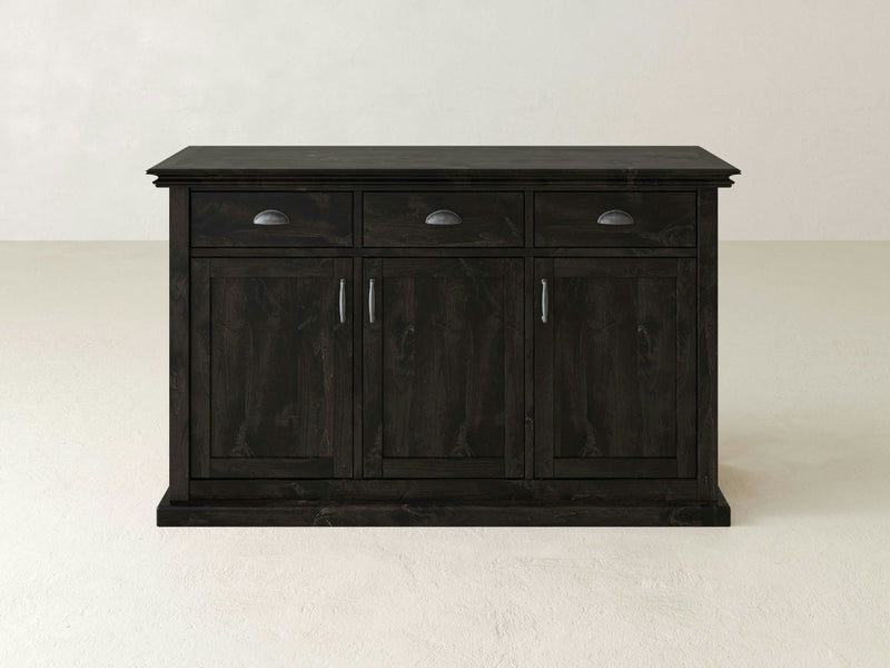 The Nora Buffet - Charred Ember by James+James features a dark wood finish with a flat top, three drawers adorned with metal handles, and three cabinet doors equipped with vertical handles. This sideboard showcases a simple, classic design and is displayed against a plain, light-colored background.