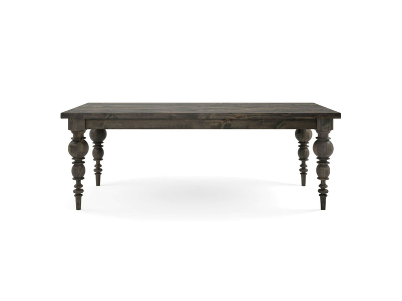 The Bailey Dining Table from James+James features a rectangular wooden surface with a deep grey finish and intricately carved, turned legs. This classic design is showcased against a plain white background.