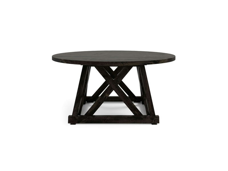 The Julia Round Dining Table - Charred Ember by James+James features a smooth, circular top made from dark wood. It is supported by sturdy legs that form an X-shaped base for added stability and style. The design is simple yet elegant, making it suitable for a variety of interiors.