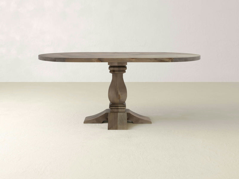 A close-up of the Heirloom Oval Dining Table - Barn Wood by James+James.