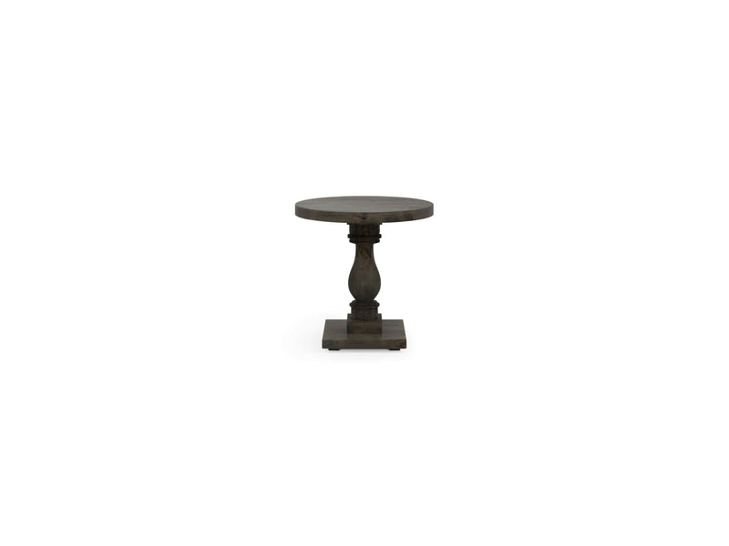 Introducing the Vivien Side Table – Deep Grey by James+James. This small, dark wood side table features a round top paired with an elegant pedestal base showcasing a beautifully carved central column and a square bottom. Its classical and sturdy design makes it suitable for various decorative settings.