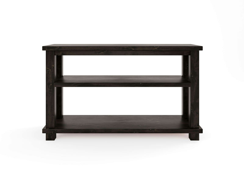 Introducing the Carter X Sofa Table in Charred Ember by James+James: a side table crafted from black wood, showcasing a rectangular top and two spacious shelves below. This minimalist design features clean lines and square legs, perfectly set against a plain white background.