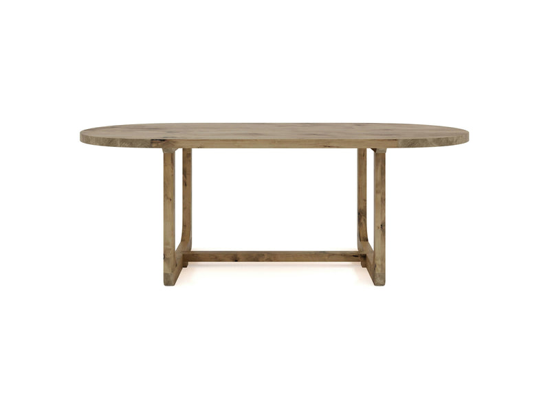 The Emersen Oval Dining Table - Harvest Wheat by James+James features an oval-shaped top and sturdy legs. The wood showcases a natural finish that highlights the timber's grain and texture. Its minimalist and rustic design makes it suitable for various interior styles.