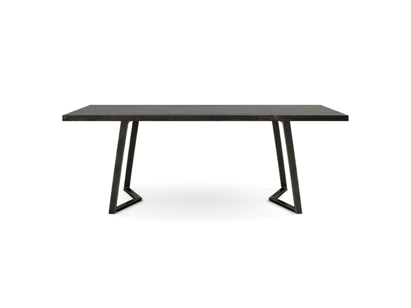 The Arkwright Dining Table - Charred Ember by James+James is a sleek, modern wooden table featuring a rectangular top and black metal legs that form stylish inverted V-shapes, adding a geometric touch to its minimalist design. The table is set against a white background.