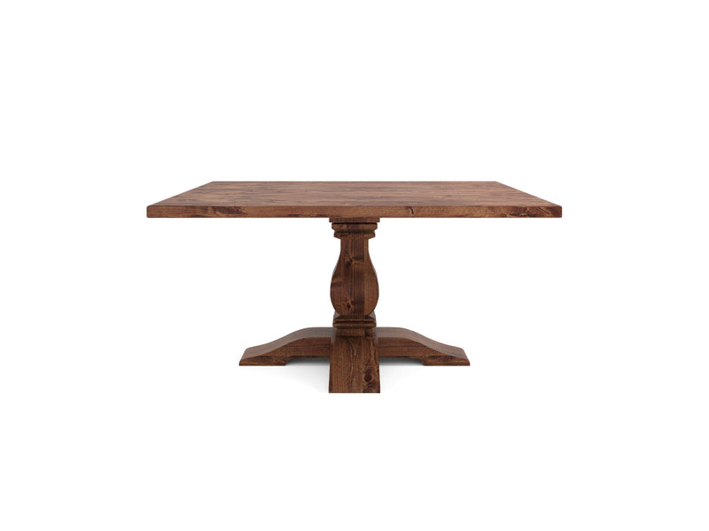 Introducing the Heirloom Square Dining Table - Tuscany by James+James, a charming wooden table featuring a pedestal base. The tabletop boasts a natural wood grain finish, while the sturdy base showcases a central column that gracefully splits into four curved legs at its foundation. This exquisite piece embodies a rustic and traditional design.