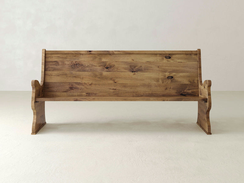 Close-up view of the Rustic Church Pew Bench - Harvest Wheat by James+James, showcasing its wooden surface with natural grain patterns and knots. The texture reveals wavy lines and a prominent knot near the center, highlighting the bench's organic and rustic appearance with a range of warm brown tones.