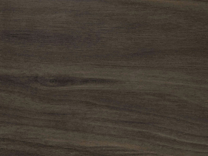 A detailed image of the Deep Grey on Black Walnut Sample by James+James showcases a wooden surface with dark grey and brown grain patterns. The texture reveals natural variations in color, accentuating the wood's organic appeal. The knots and streaks contribute to its distinctive rustic character.