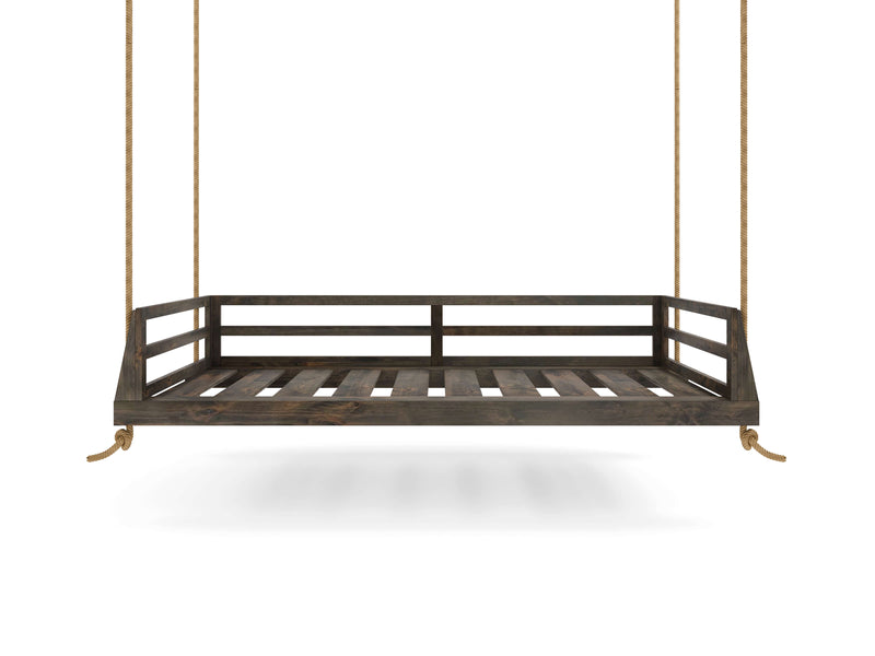 Introducing the Piper Porch Swing - Deep Grey by James+James, a rustic wooden swing bed suspended by thick ropes. It features a slatted base and backrest with a simple, sturdy frame. The swing bed hangs in mid-air against a plain white background, embodying timeless elegance and durability.