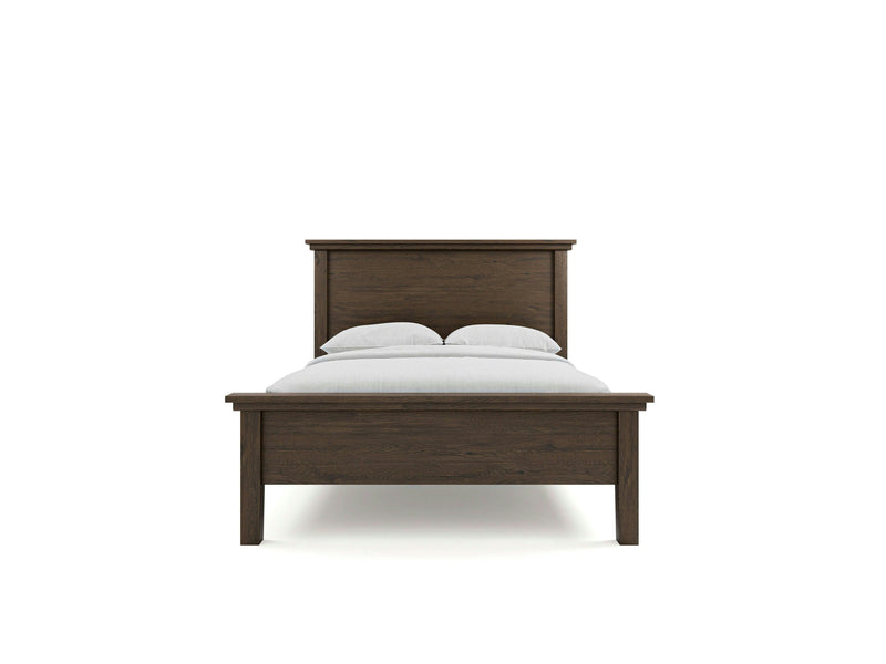 The James+James Ivy Bed - Charred Ember is a wooden bedframe with a headboard and footboard, boasting a dark brown finish. It is dressed in white bed linens and two pillows, set against a plain white background.