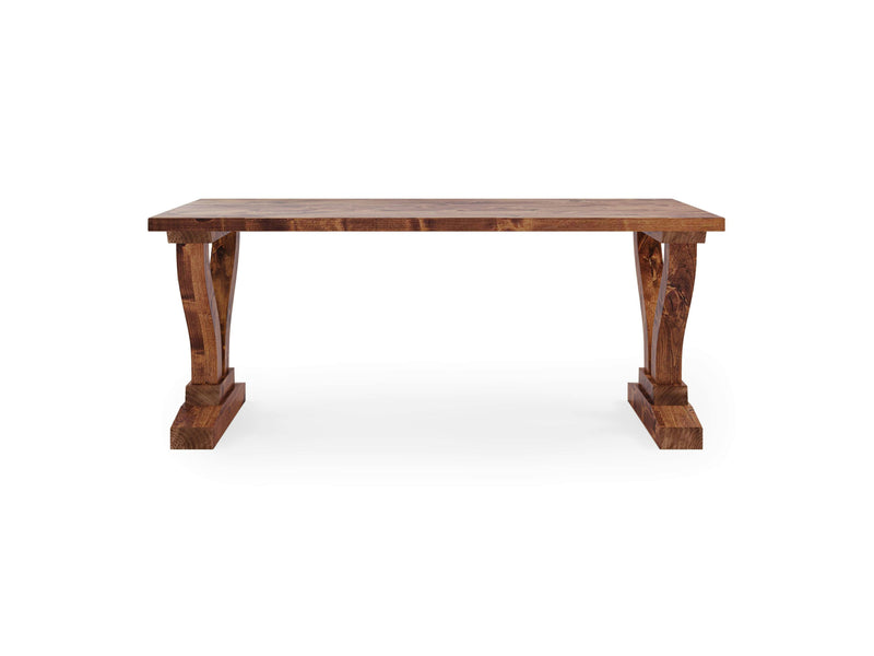 The Vera Desk - Tuscany by James+James features a rustic wooden design with a rectangular top and two wide, ornately carved pedestal legs on either side. The desk showcases a natural wood grain finish, giving it a sturdy and traditional appearance.