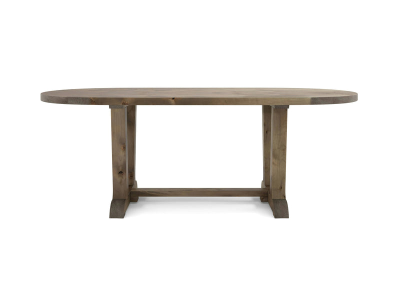 The Thaden Oval Dining Table by James+James is crafted from barn wood and features a rustic finish. This oval-shaped table showcases a sturdy trestle-style base with two rectangular supports connected by a horizontal beam. Visibly textured wood grain enhances its natural and earthy appearance.