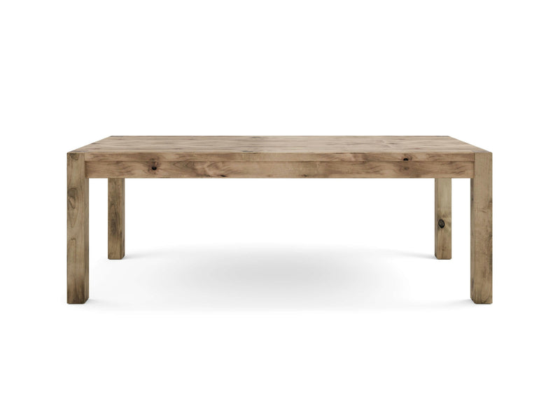 An image of the Jonathan Dining Table - Harvest Wheat by James+James, featuring a rectangular design with a simple, rustic appeal. The table boasts four sturdy legs and a substantial, flat tabletop, all crafted from light-colored wood with visible natural grain patterns.