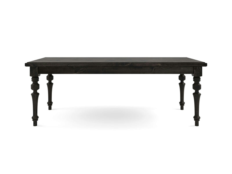 The Allyson Dining Table - Charred Ember by James+James features a dark wooden rectangular top and intricately designed turned legs, showcased against a plain white background. This table exudes a classic, antique style with a sturdy and elegant appearance.