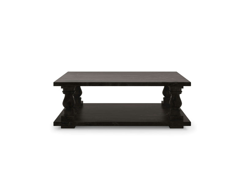 The Vivien Coffee Table - Charred Ember by James+James is a square, dark wooden coffee table featuring a second, lower shelf. It boasts thick, square legs with intricate carved details and a smooth, flat top surface. The overall design is sturdy and traditional.