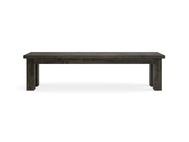 A straightforward and elegant deep grey wooden bench by James+James, known as the Farmhouse Bench, features a rectangular seat and four straight legs. The bench is photographed against a plain white background.