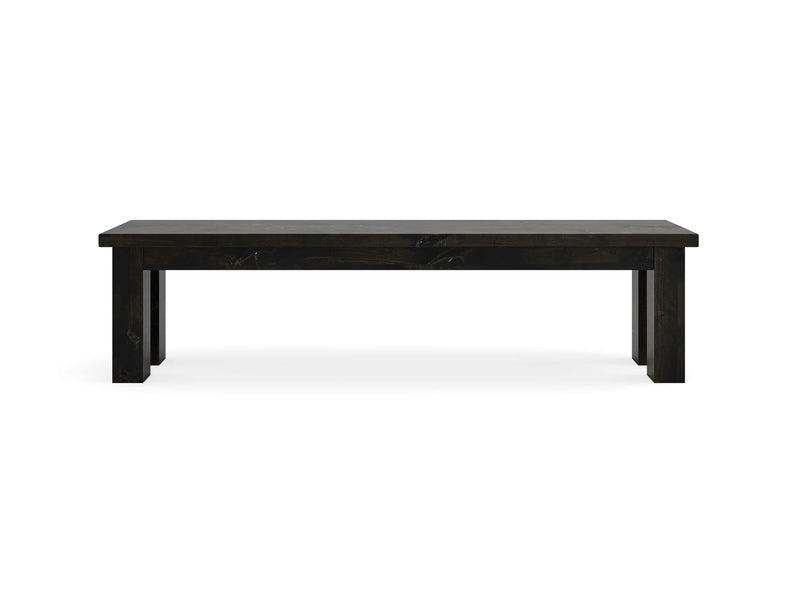 A minimalist black wooden bench with a rectangular top and sturdy legs, the Farmhouse Bench - Charred Ember by James+James boasts a sleek, modern design and is set against a plain white background.