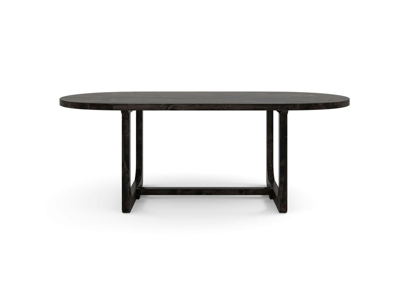 The Emersen Oval Dining Table - Charred Ember by James+James features a modern, oval-shaped black wooden design with a flat surface. The table stands on straight, minimalist legs that are supported on both sides and connected at the base by horizontal crossbars. It is set against a plain white background.