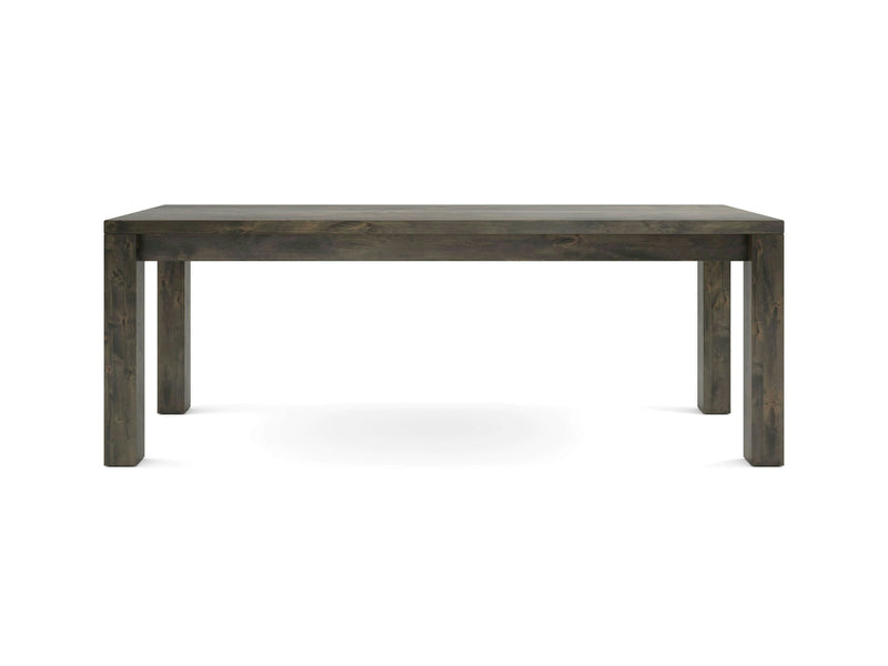 A sturdy, rectangular Jonathan Desk in deep grey from James+James. The desk features four thick legs and a simple, minimalist design, highlighting the natural wood grain. It stands on a plain white background.