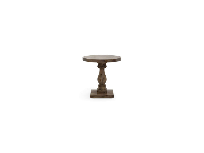 The Vivien Side Table - Barn Wood by James+James is a small, round wooden side table with a pedestal base. It features a decorative, carved central support column and a square bottom platform, all finished in a rustic style. The table is placed against a white background.