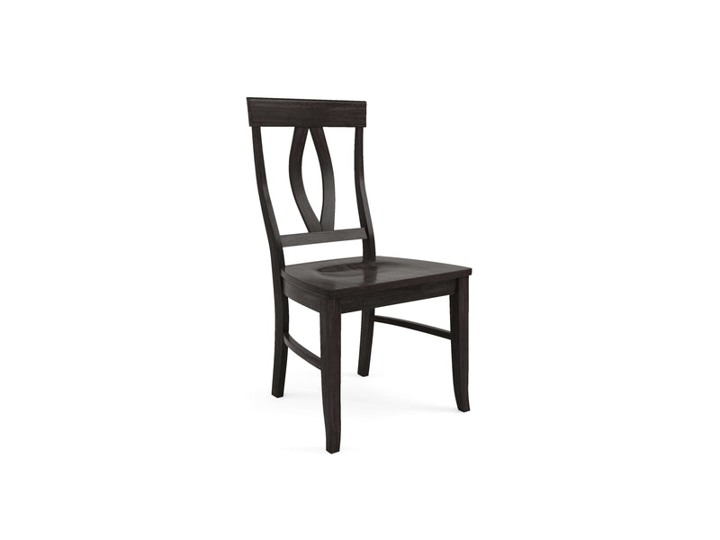 The Elizabeth Dining Chair - Charred Ember by James+James is a black wooden chair with a tall backrest featuring a decorative, curved design. It boasts a smooth seat and four straight legs. The photo captures an angled view, showcasing the chair’s side and part of the back.