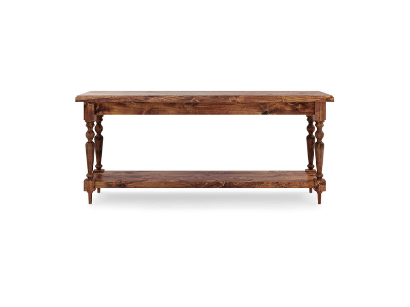 The Ella Sofa Table - Tuscany by James+James is a wooden console table featuring a rectangular top and a lower shelf. It boasts four intricately carved legs with a classic design, beautifully connecting the top to the lower shelf. The wood showcases a rich brown finish, adding both rustic charm and elegant sophistication.