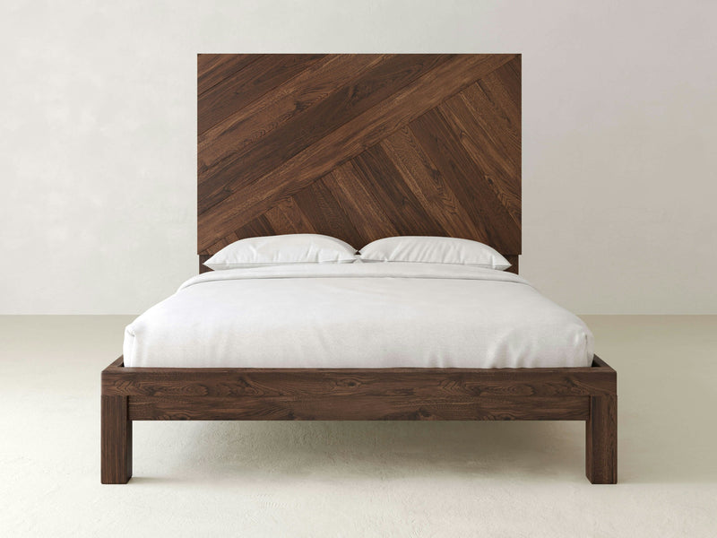 A James+James Luna bed in Tobacco finish featuring a wooden headboard.