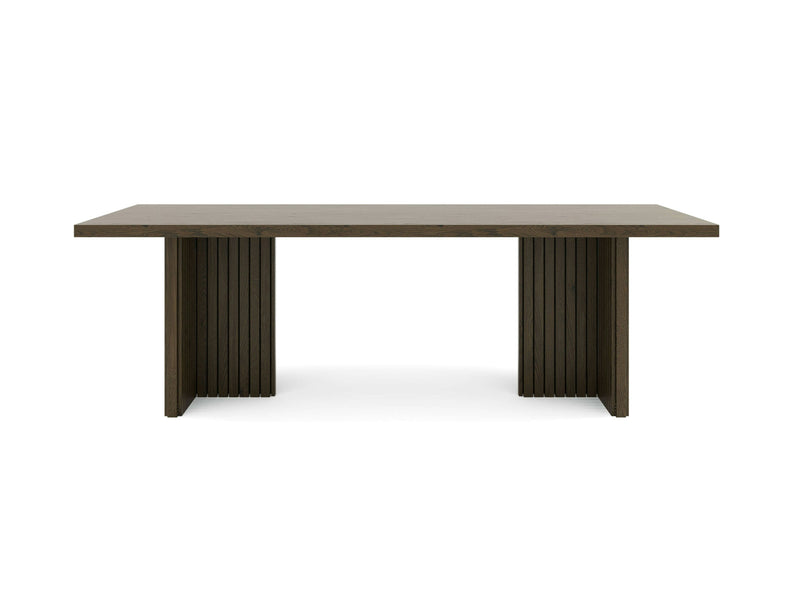 The Francesca Dining Table - Charred Ember by James+James is a rectangular dining table with a minimalist design. It features a flat tabletop and two vertical slatted base supports, showcasing clean lines and a modern aesthetic. The dark wood table is presented against a white background.