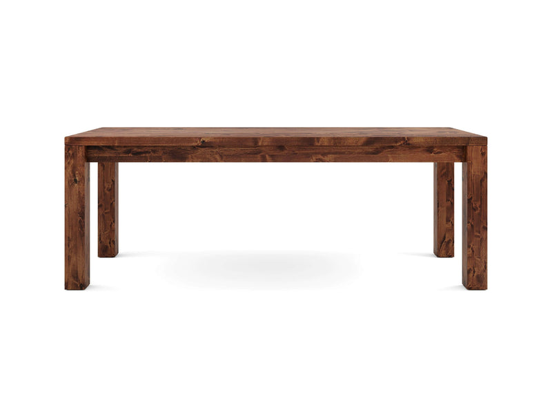 The Jonathan Desk - Tuscany by James+James is a simple, rectangular wooden table with a rich brown finish. The table features sturdy, straight legs that perfectly match the tabletop, creating a cohesive and rustic look. Its design is minimalistic, characterized by clean lines and no additional adornments.