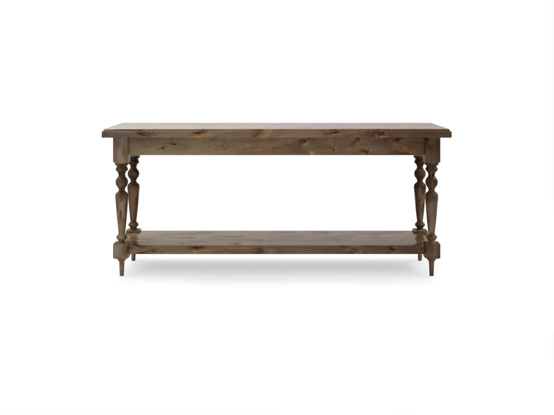 The Ella Sofa Table - Barn Wood by James+James is a wooden console table featuring a rectangular top and an additional lower shelf for extra storage. It boasts decorative turned legs that connect the top to the bottom shelf, and is finished in a natural wood tone, providing a rustic yet elegant appearance.