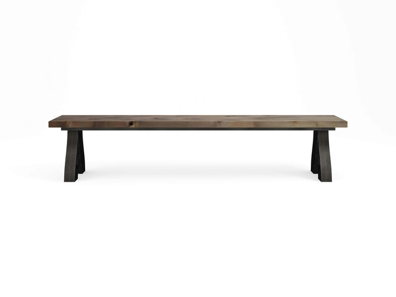 Introducing the Wishbone Bench - Barn Wood by James+James: a long, minimalist wooden bench featuring a simple, rectangular seat and sturdy, angled legs. Crafted from dark barn wood, this bench boasts a clean, modern design with no visible embellishments. Set against a white backdrop, the Wishbone Bench takes center stage.