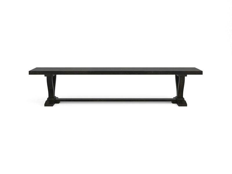 The Vera Bench - Charred Ember by James+James is a long, rectangular wooden bench in dark brown with a straightforward design. It features two sturdy legs and a connecting horizontal support beam at the base, all set against a plain white background.