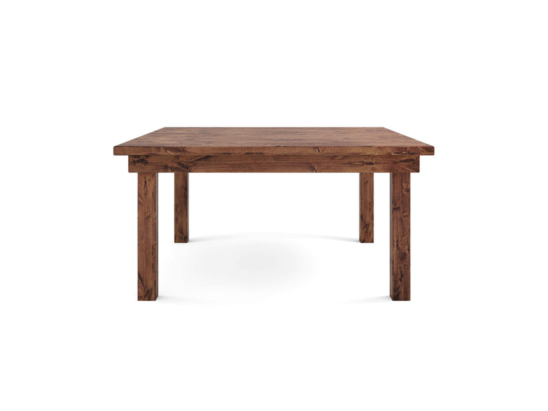 The Farmhouse Square Dining Table - Tuscany from James+James is a rustic wooden table with four sturdy legs, showcased against a plain white background. Its simple yet robust design features a natural wood finish that beautifully highlights the texture and grain of the wood.