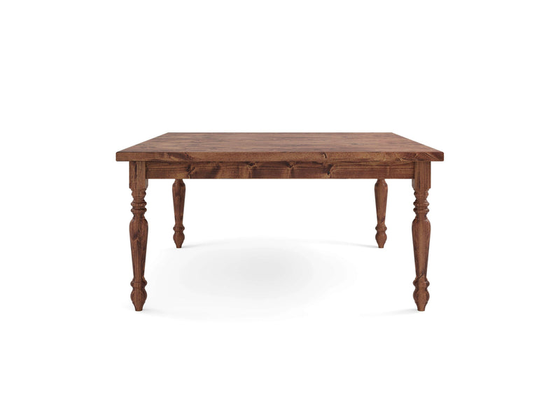 The French Country Square Dining Table - Tuscany by James+James features a stunning square top and four intricately carved legs. The natural wood finish highlights its grain and texture, lending a rustic yet classic charm to the overall design.