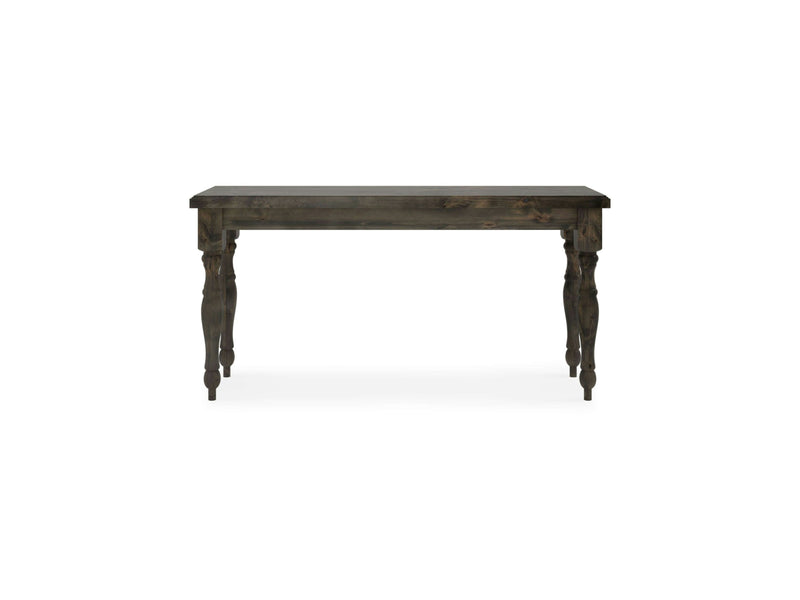 A deep grey Abigail Sofa Table from James+James features a rectangular top and four intricately carved legs. The table boasts a rustic, antique finish and is placed against a white background, highlighting its classic design and craftsmanship.