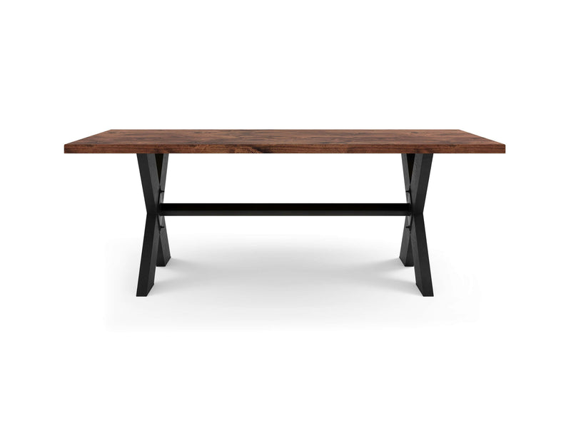 The X-Base Dining Table - Tuscany by James+James features a thick, dark brown tabletop and sturdy black metal legs arranged in an X-shape. It boasts a minimalist design and an industrial look, set against a white background.