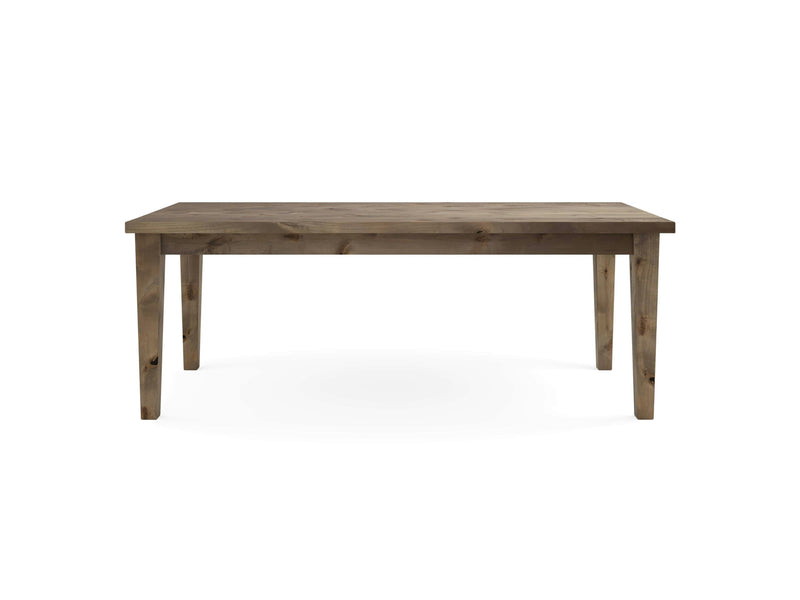 The Ava Parsons Dining Table - Barn Wood by James+James is a rectangular wooden dining table featuring a simple design and four tapered legs. Its natural, rustic finish and lack of additional adornments or features create an elegant yet unadorned aesthetic. The table is showcased against a plain white background.