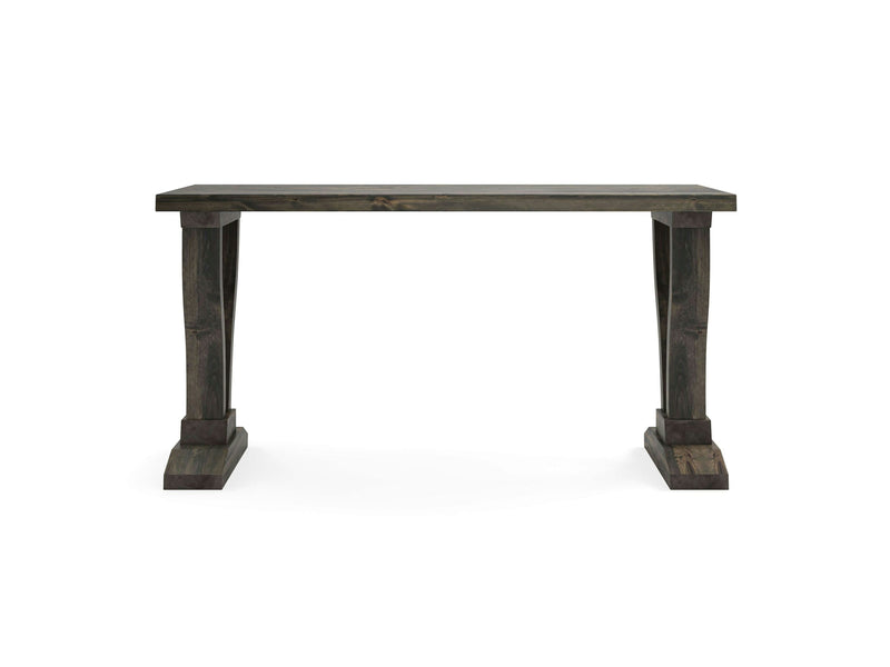 Introducing the Vera Sofa Table by James+James, featuring a deep grey color and a rustic finish. This sophisticated piece boasts a rectangular top supported by two thick, carved pedestal-style legs on either end. The wide and flat leg bases ensure both sturdiness and elegance.