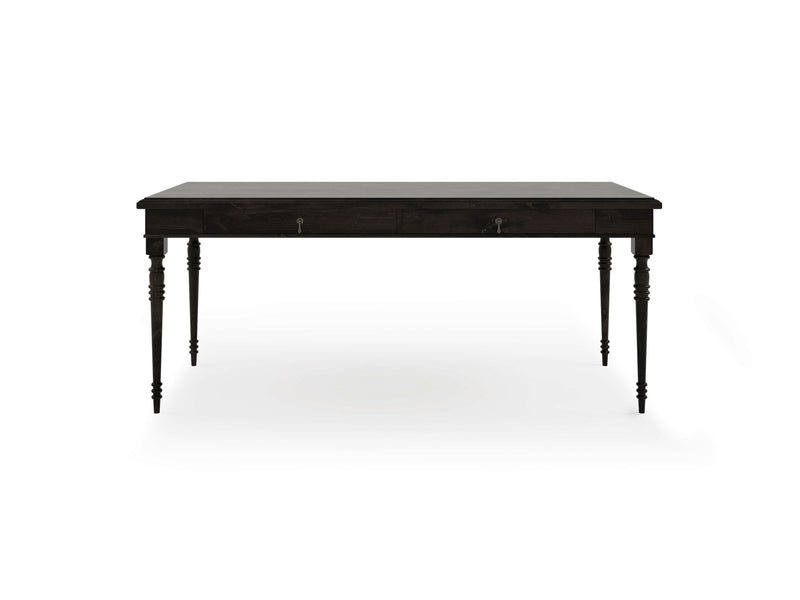 The Audrey Desk - Charred Ember by James+James features a dark wooden rectangular top with two drawers adorned with small metal handles, and four intricately carved legs. The desk is presented against a plain white background.