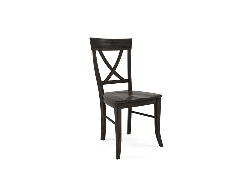 The Juniper Side Dining Chair by James+James features a charred ember finish, showcasing a dark wood frame with a curved backrest and crossed design. Its slightly tapered legs and smooth-finished seat contribute to its traditional yet elegant appearance. This chair boasts a sturdy build, standing alone against a white background.