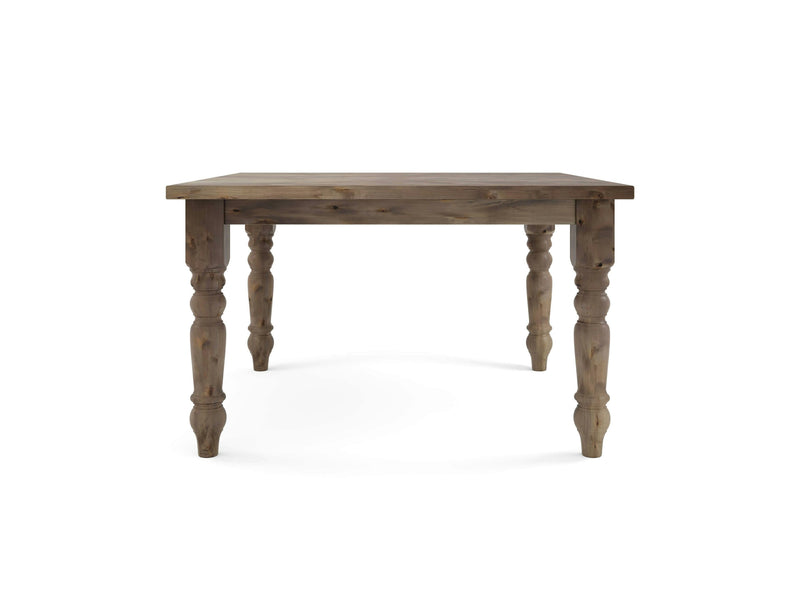 The Baluster Square Dining Table - Barn Wood by James+James features a rectangular top and intricately carved, tapered legs. The table is in a natural wood color, showcasing its grain and texture, and is positioned on a white background.