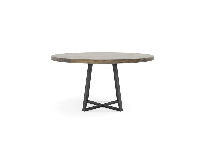 A Watson Round Dining Table - Barn Wood by James+James, featuring a light brown finish with black, metal, cross-shaped legs, stands against a white background. The table boasts a minimalist design and modern aesthetic.