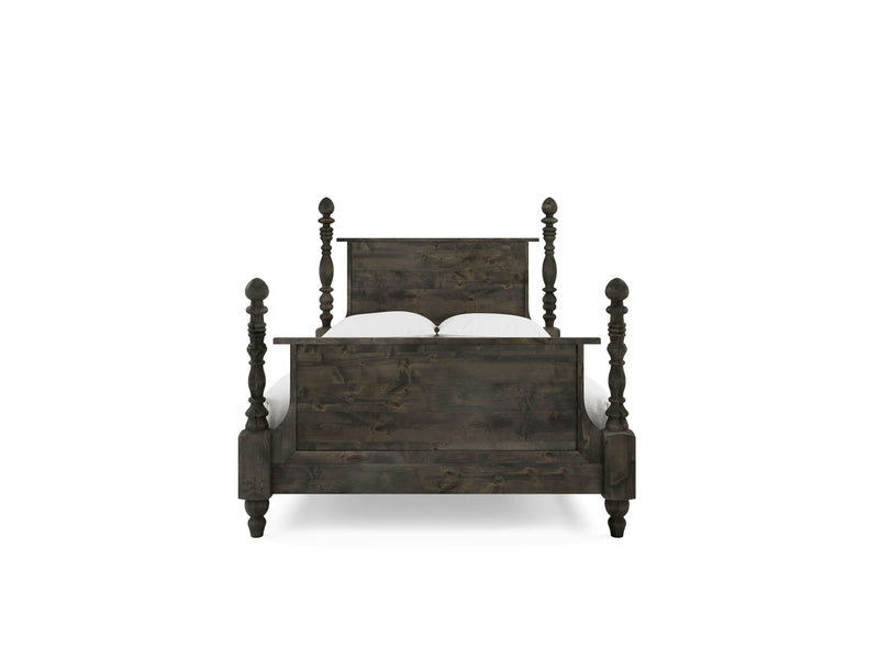 The Catherine Bed - Deep Grey by James+James features a dark wooden frame with intricately carved posts on all four corners, complemented by a high headboard and footboard. The bed is neatly made with white bedding, and the image, taken from the front, showcases its detailed craftsmanship.