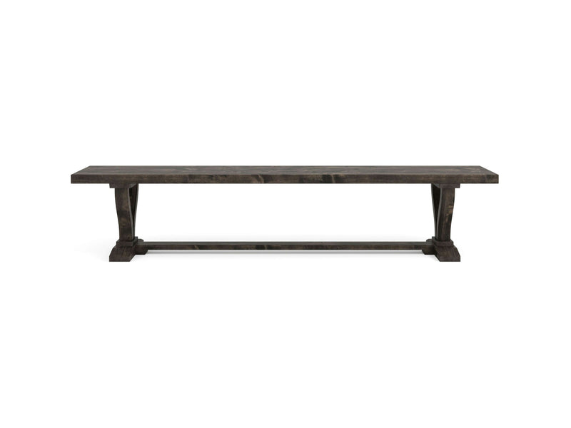 The Vera Bench - Deep Grey by James+James features a long wooden design with a flat rectangular seat and sturdy trestle legs on each end. The bench boasts a deep grey finish that accentuates the wood grain, giving it a traditional, robust appearance. Its simple and functional design makes it an ideal addition to any space.