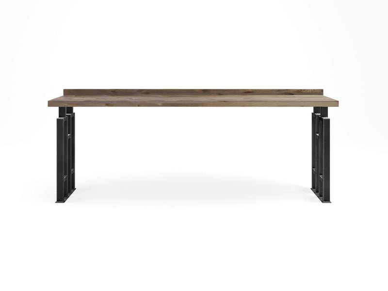 The Clark Sofa Table - Barn Wood by James+James is a minimalist wooden table with a natural finish top and black metal legs. It features a raised back edge, giving it a sleek and modern appearance, and is set against a plain white background.