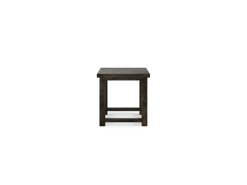 The Carter X Side Table by James+James, featured in a deep grey finish, showcases a dark wooden square design with four legs, a flat tabletop, and a horizontal support bar near the bottom. It exudes a rustic appearance and is presented isolated on a white background.