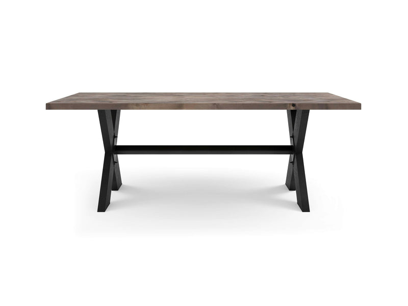 A James+James X-Base Dining Table - Barn Wood showcases a rustic finish with black crossed metal legs forming an X shape on each side and a sturdy central support beam connecting the legs. The table is set against a white background.