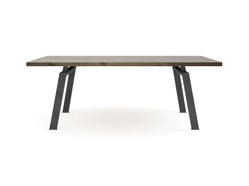 The Fulton Dining Table - Barn Wood by James+James is displayed against a plain white background. This rectangular wooden table features a smooth surface and sleek metal A-frame legs, exuding a minimalist design with clean lines and a modern aesthetic.